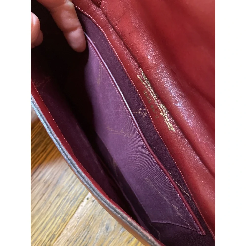 Elegant‎ Burgundy Etienne Aigner Leather Clutch Handbag with Gold Oval Accent